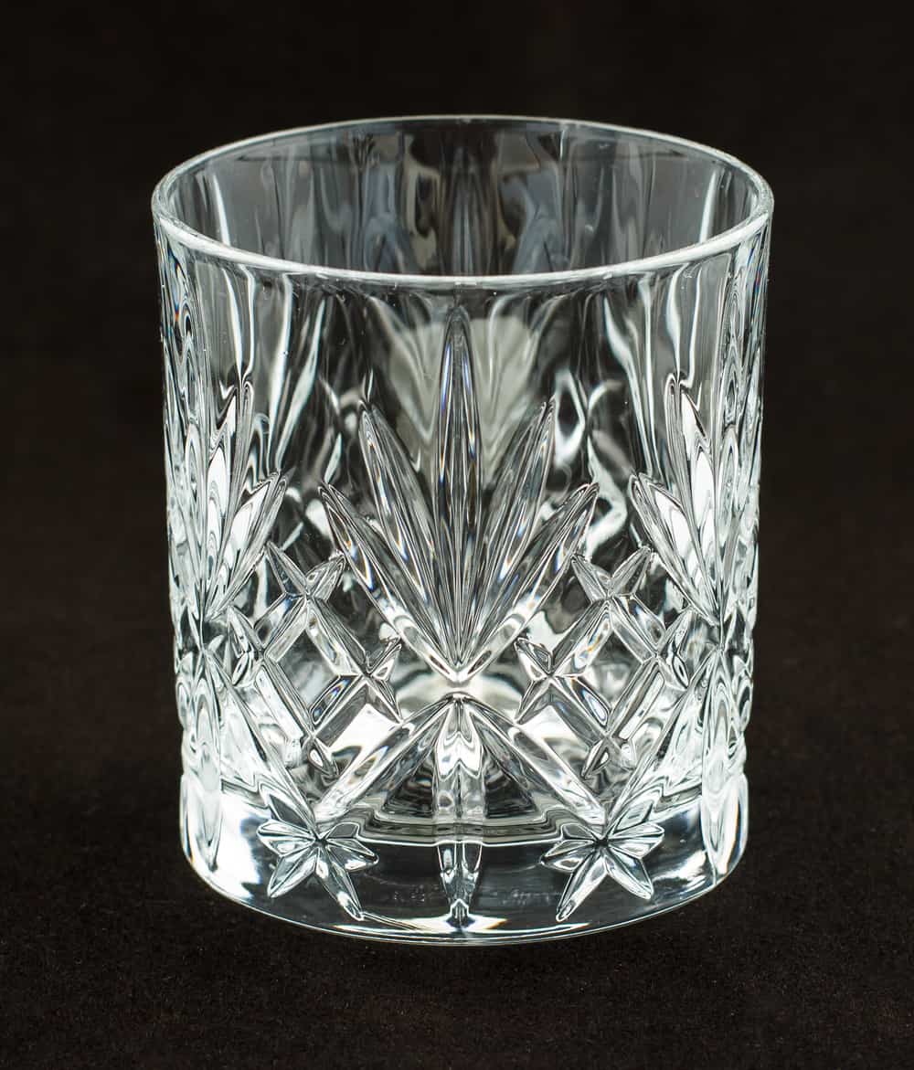 A short glass with a diamond pattern etched into it.