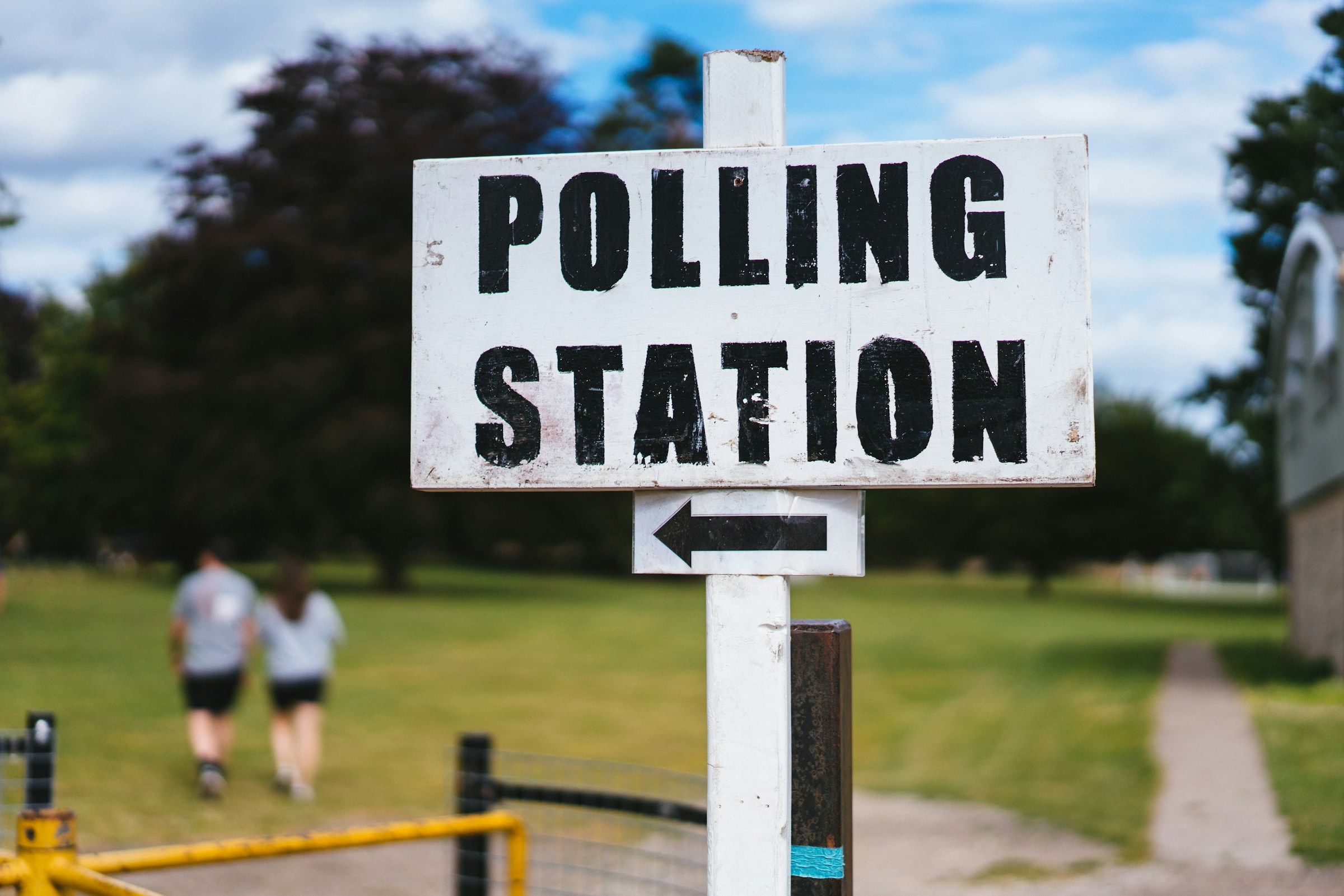 Photo by [Phil Hearing](https://unsplash.com/@philhearing) on [Unsplash](https://unsplash.com/photos/a-pole-with-a-sign-that-says-polling-station-bu27Y0xg7dk)