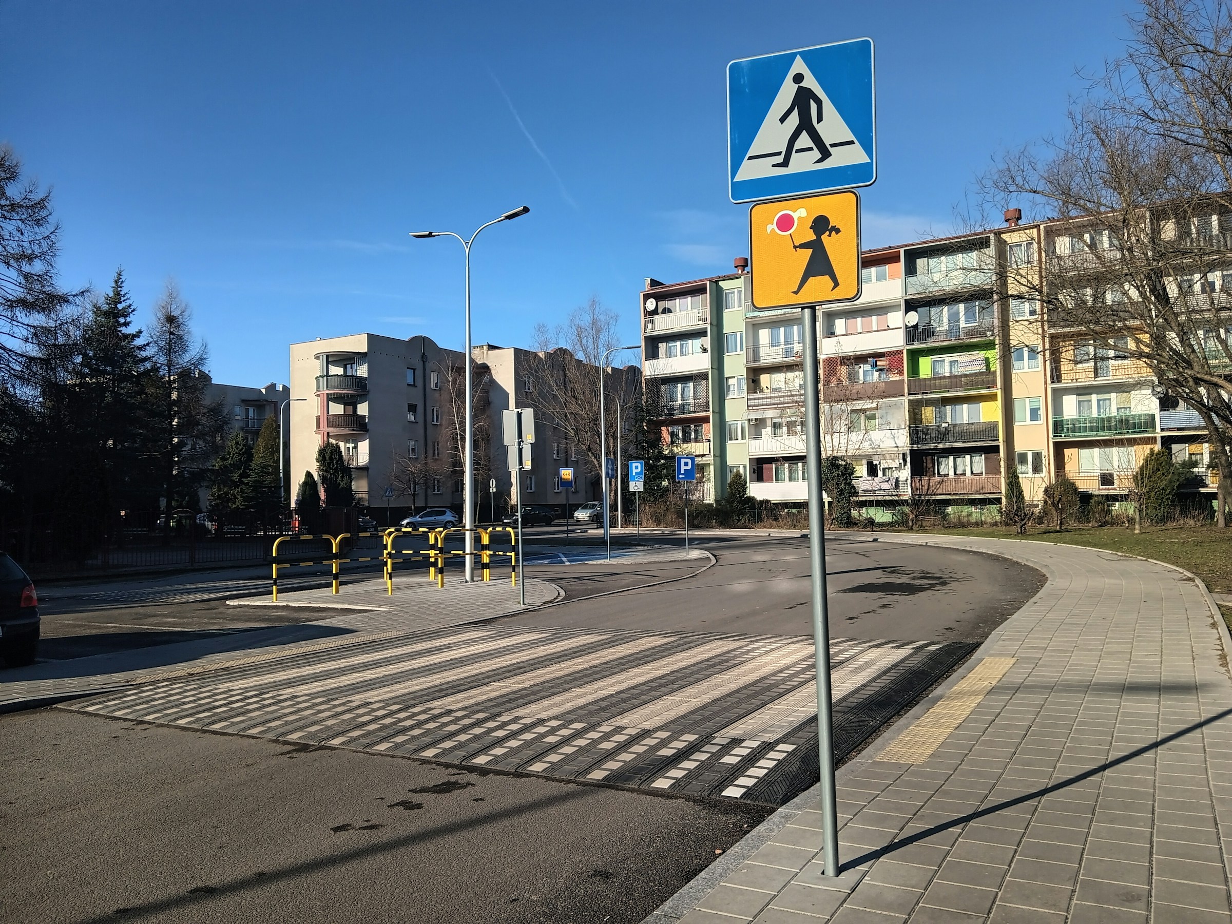 Photo by [WrS.tm.pl](https://unsplash.com/@wrstmpl) on [Unsplash](https://unsplash.com/photos/a-blue-and-yellow-pedestrian-crossing-sign-sitting-on-the-side-of-a-road-uZYxoXTk_Us)
