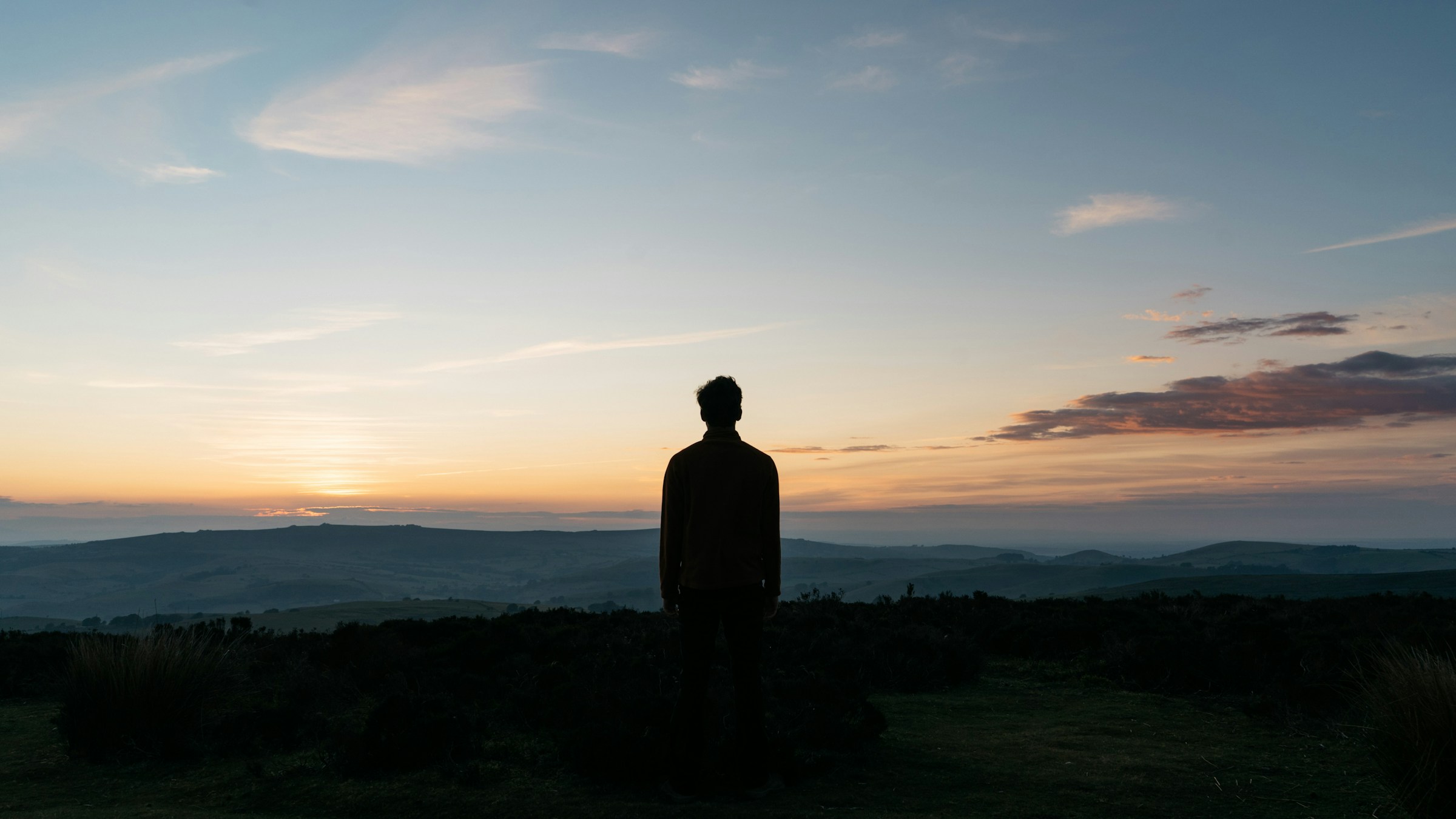 Photo by [Tom Allport](https://unsplash.com/@t_mallp_rt) on [Unsplash](https://unsplash.com/photos/silhouette-of-man-standing-on-green-grass-field-during-sunset-eoRxpc7GDbM)