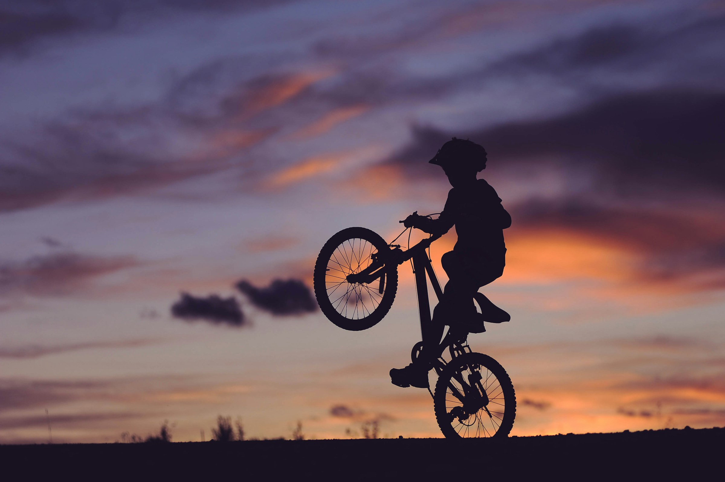 Photo by [Clark Young](https://unsplash.com/@cbyoung) on [Unsplash](https://unsplash.com/photos/silhouette-of-boy-riding-bicycle-in-wheelie-during-golden-hour-lQuWIesgs5Q)