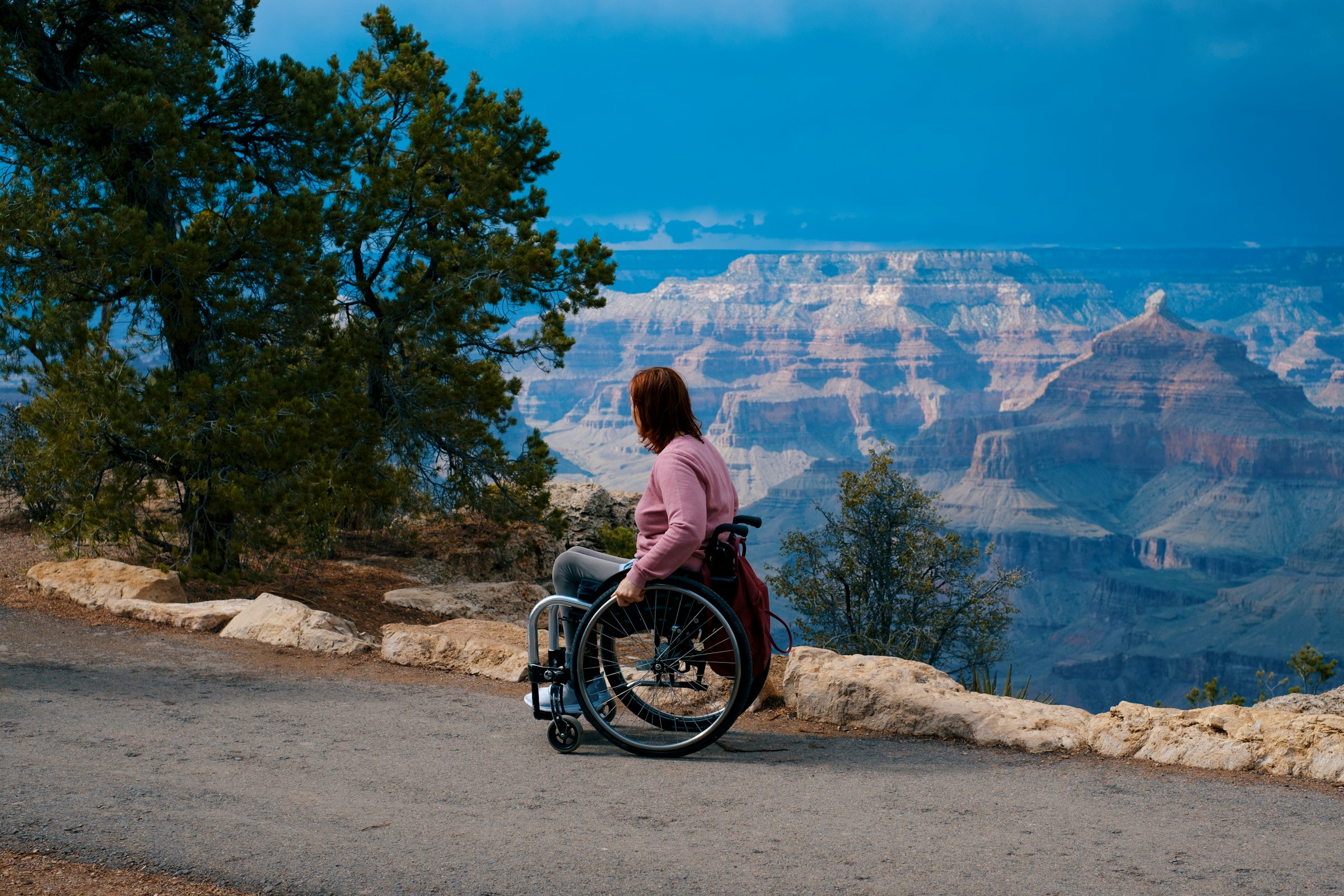 Photo by [Romain Virtuel](https://unsplash.com/@romainvirtuel) on [Unsplash](https://unsplash.com/photos/a-woman-in-a-wheel-chair-at-the-edge-of-a-cliff-DKLDOLaZtXs)