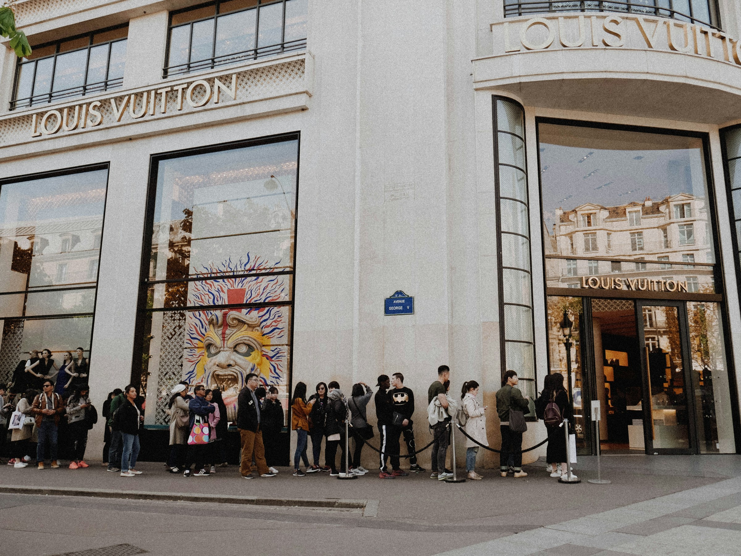 Photo by [Melanie Klepper](https://unsplash.com/@melanie_sophie) on [Unsplash](https://unsplash.com/photos/people-queuing-beside-louis-vuitton-store-SsBI9pweAeA)