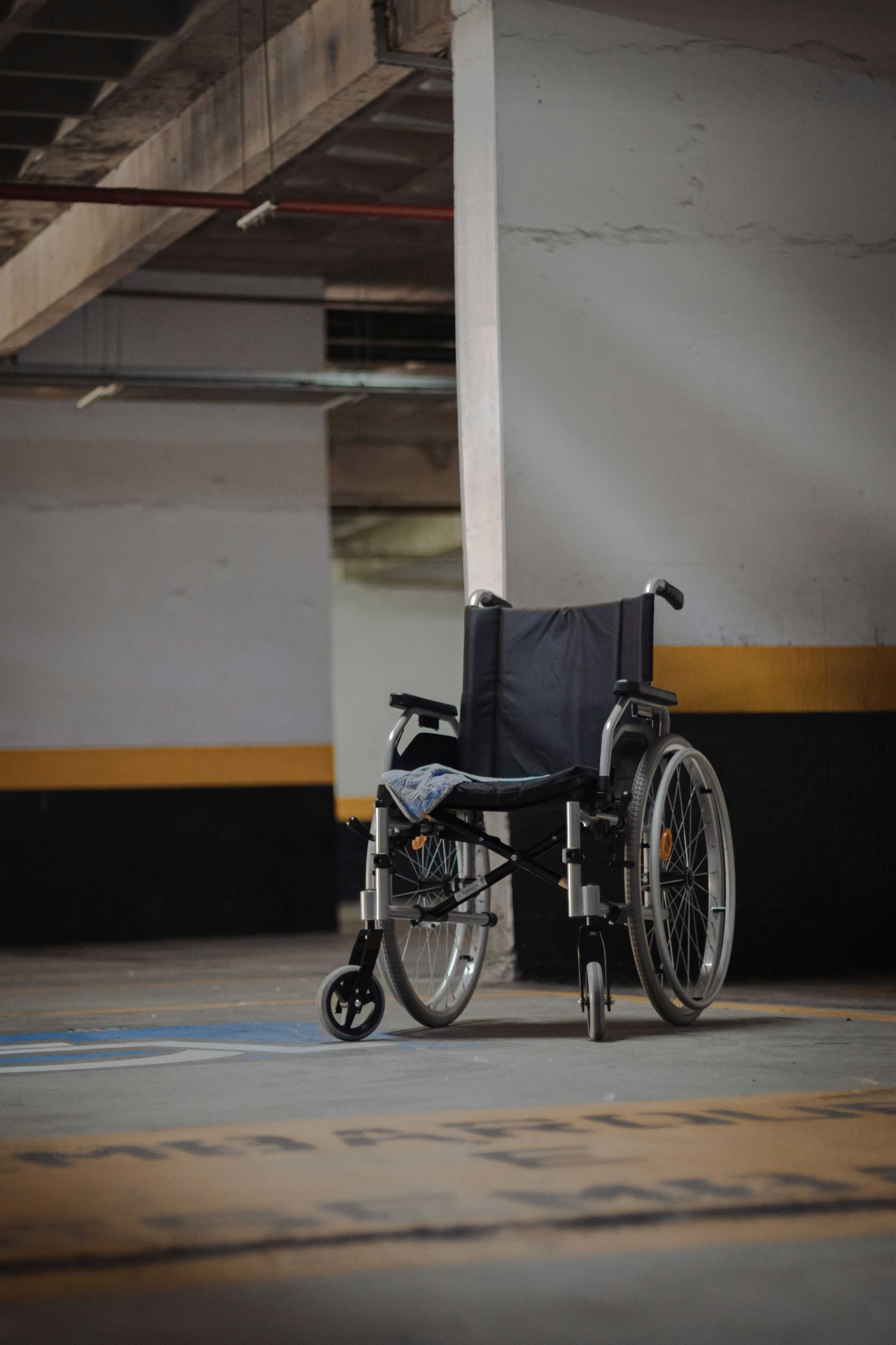 Photo by [vitor camilo](https://unsplash.com/@vitor_camilo) on [Unsplash](https://unsplash.com/photos/black-and-gray-wheelchair-on-blue-floor-7NoYTT9OmiI)